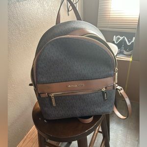 Mini 12in like new Michael Kors brown leather backpack
